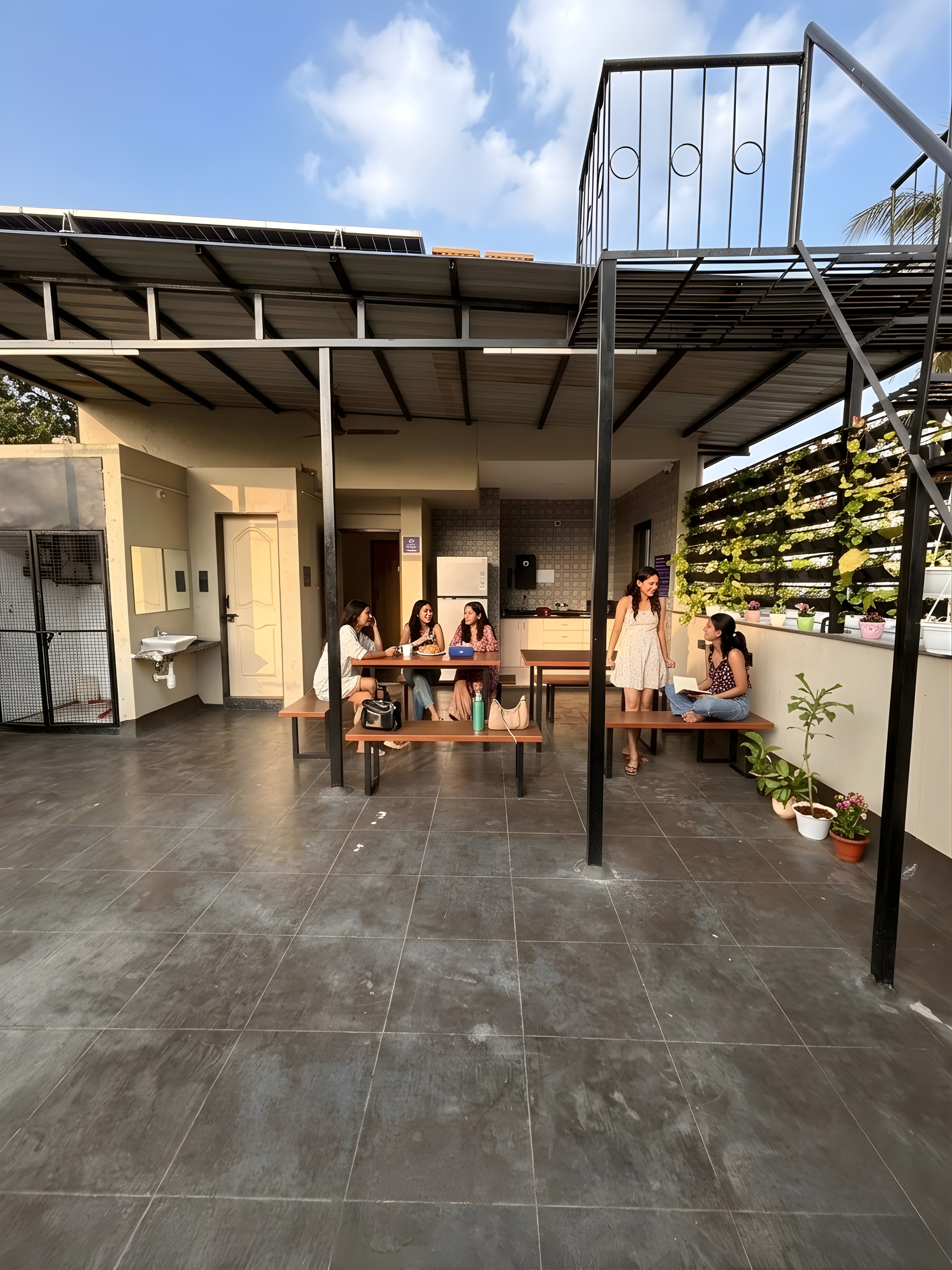 Rooftop cafe and common area at D Gloaming Nest PG hostel Pune